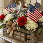 rustic Memorial Day centerpiece with roses, hydrangeas, flags, and wooden box decor.