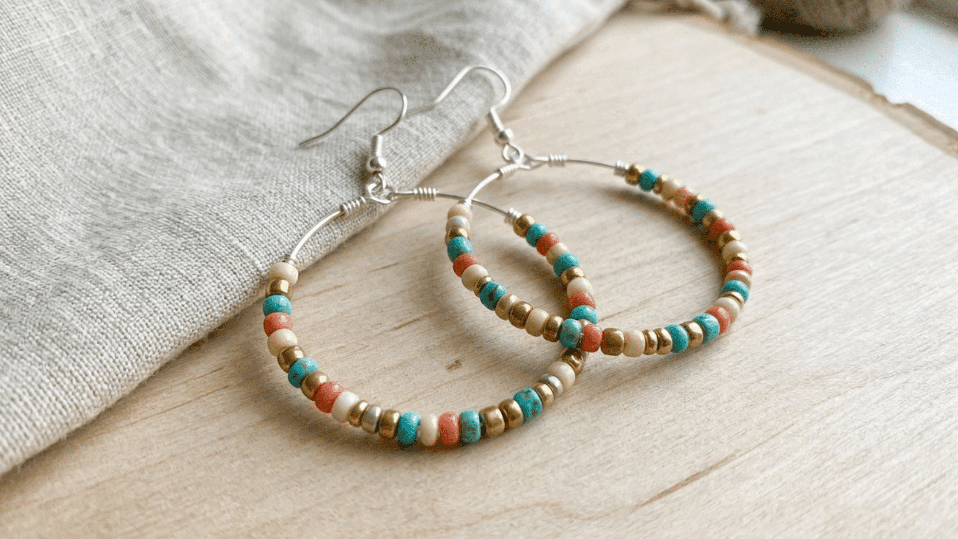 simple hoop earrings made from wire placed on flat surface in minimal jewelry style