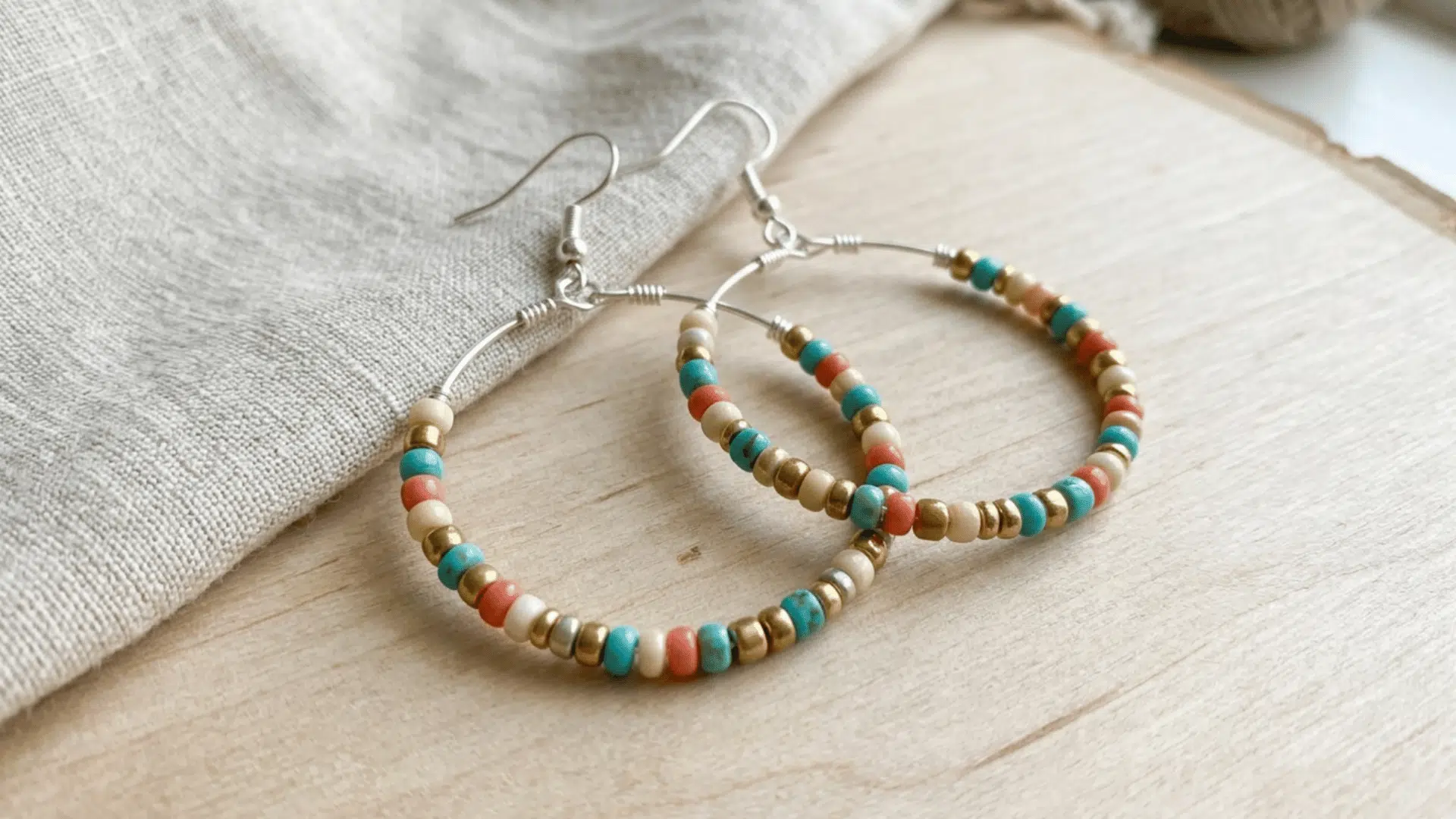 simple hoop earrings made from wire placed on flat surface in minimal jewelry style