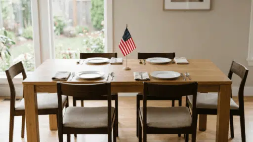 single flag at center, neutral plates, clean minimal setup, soft light