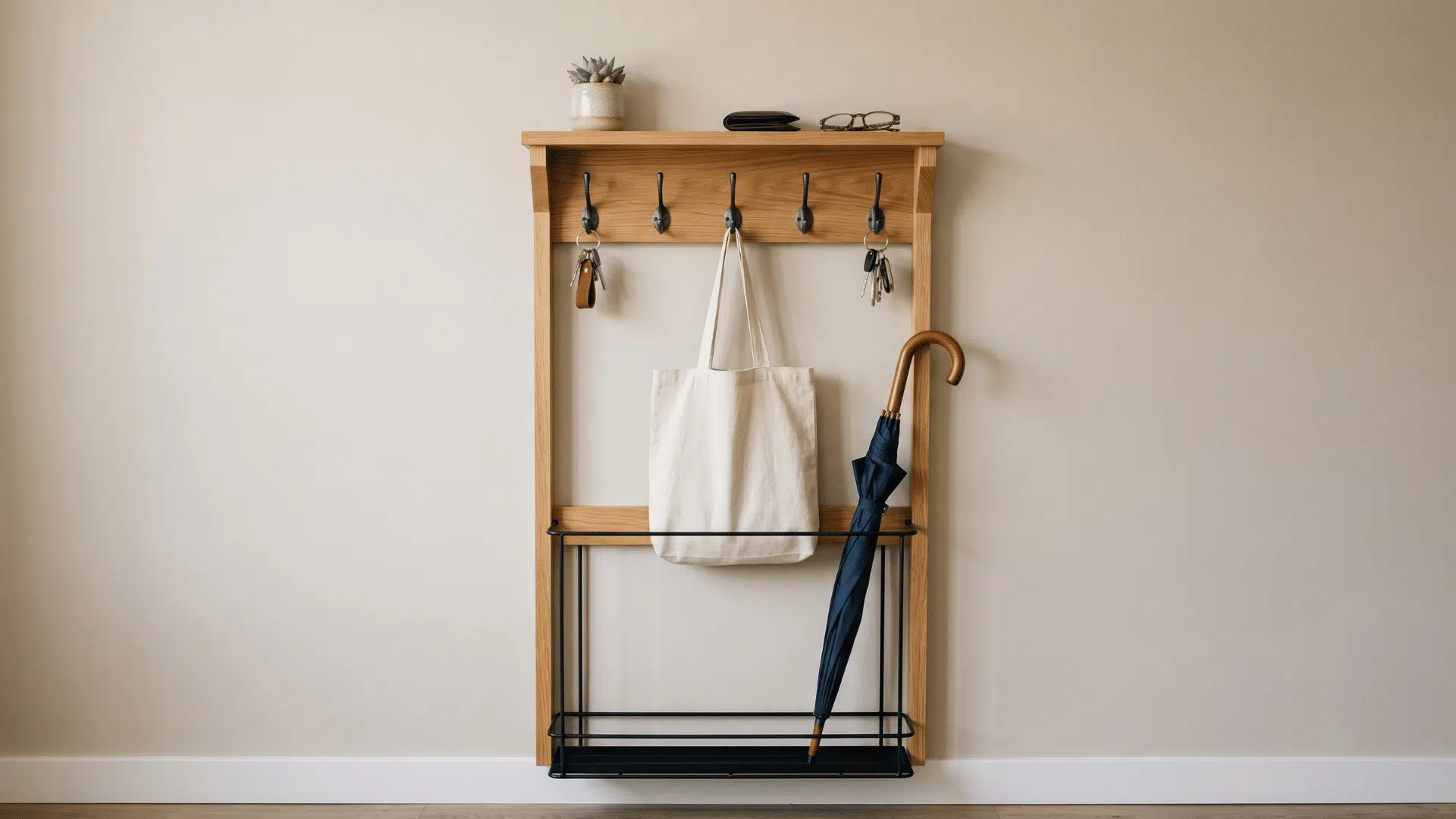 wall organizer with hooks shelf and umbrella holder near entry door