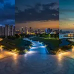 City skyline at dusk with illuminated curved pathways and dramatic clouded sky