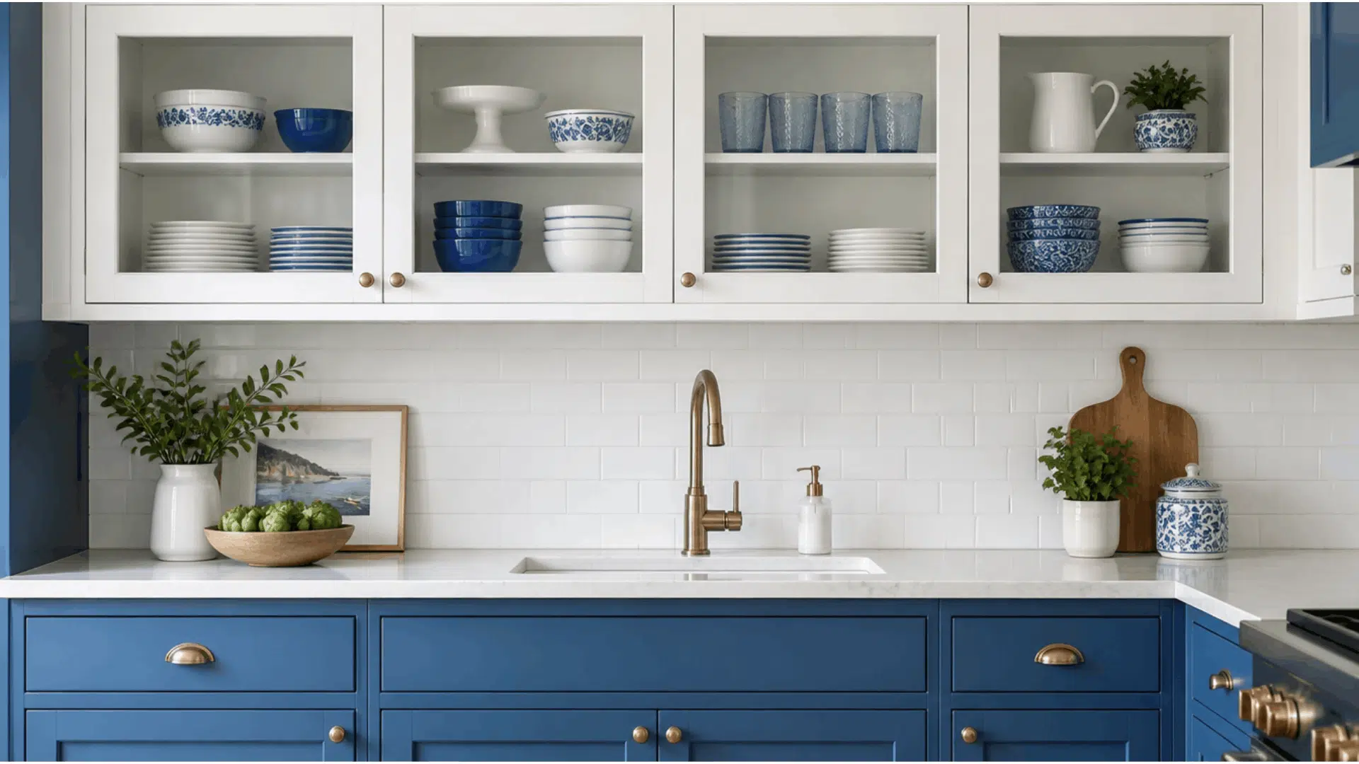 blue lower cabinets with glass front upper cabinets displaying dishes and white subway tile backsplash