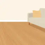flat vector living room with warm engineered hardwood flooring sofa and plant in soft muted tones
