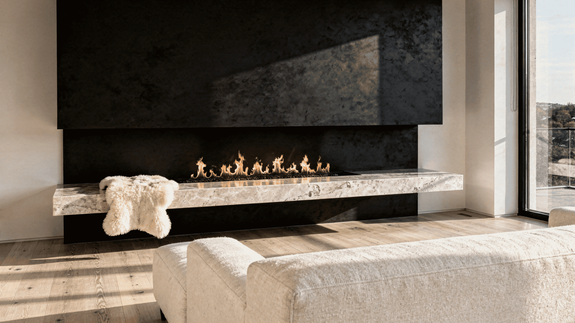 a minimal plaster fireplace mantel in a neutral taupe room styled simply with a sculptural white ceramic vase with dried stems and a stack of books with a small brass decorative object