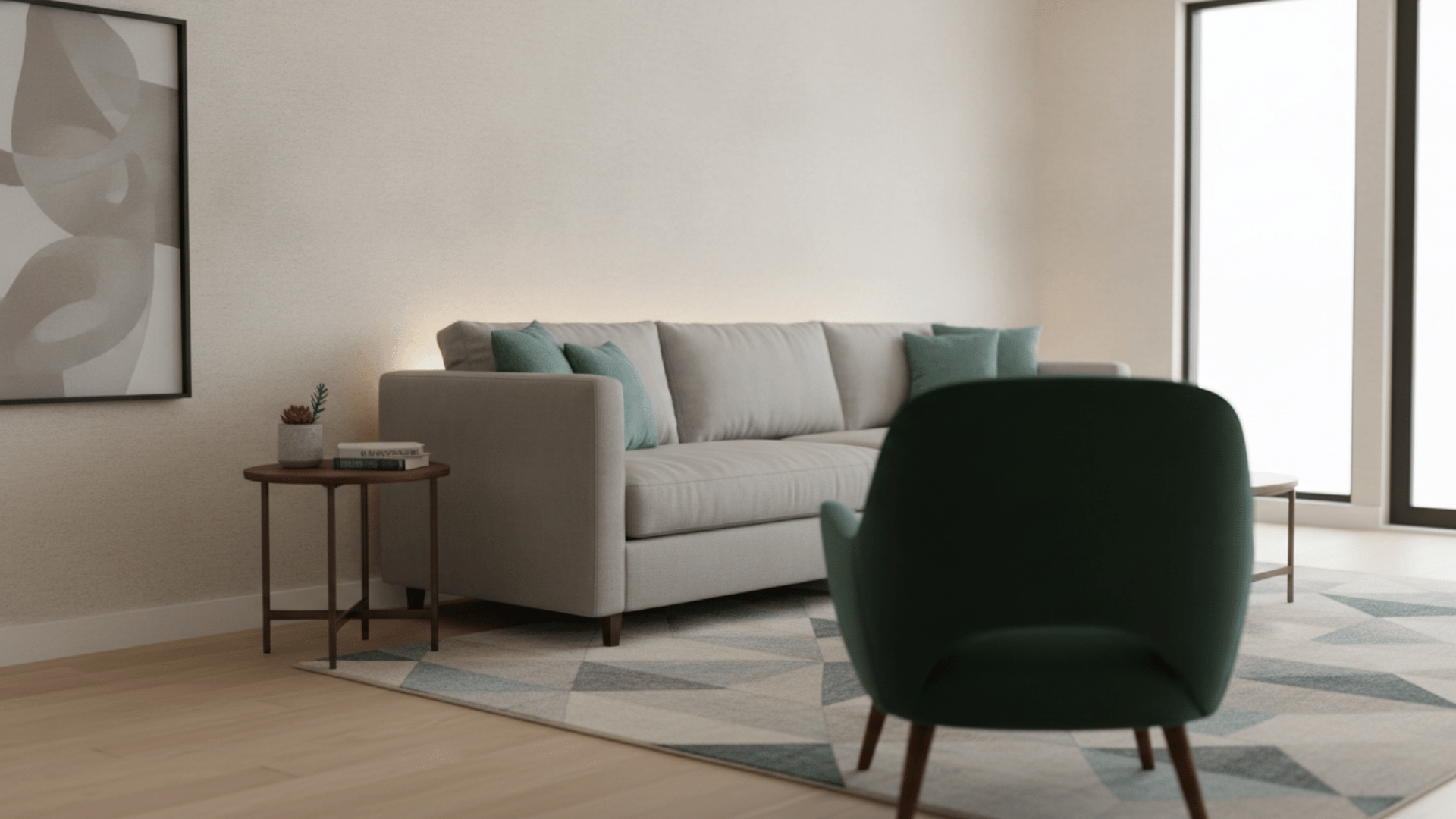 a modern living room with gray sofa teal pillows green chair abstract wall art side table and geometric rug