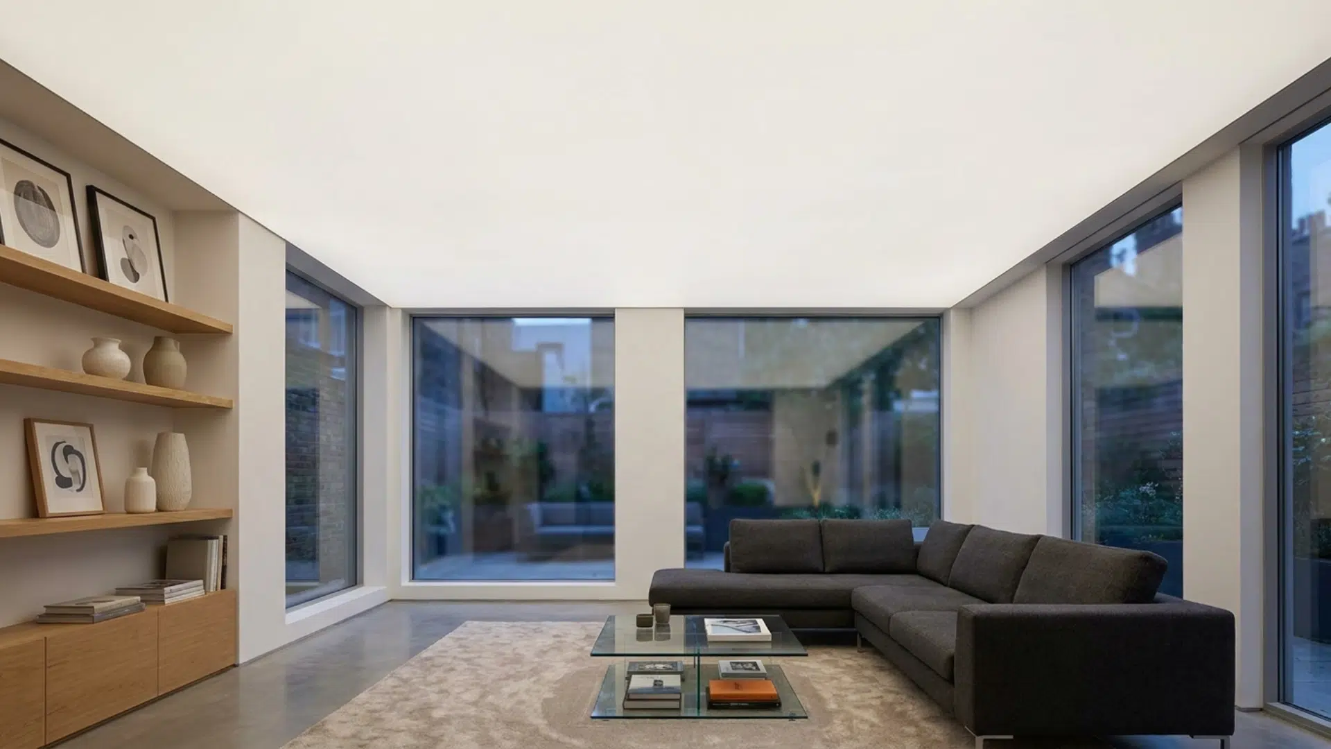 A modern living room with seamless stretched ceiling in smooth matte finish.