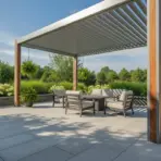 Outdoor patio with modern pergola, cushioned seating, and lush greenery on sunny day