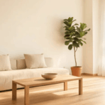 beige sofa with wooden coffee table and potted plant in sunlit room minimalist interior ideas to try this year