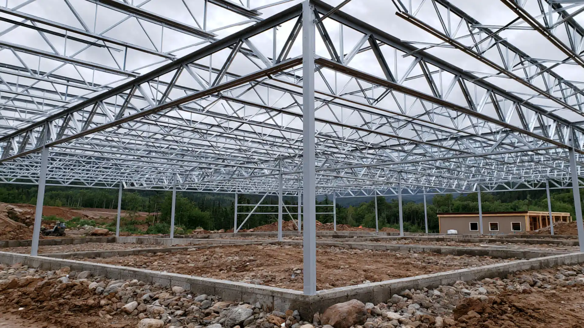 large warehouse roof frame with metal purlins spanning structure