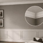 dining room with crown molding and wainscoting with a zoomed inset of the corner joint and diy tools