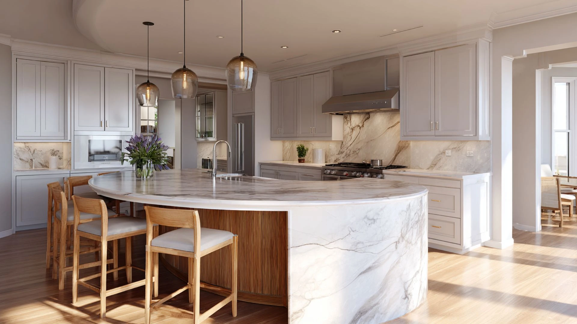 curved wraparound kitchen island end with marble waterfall countertop and wood bar stools on three sides