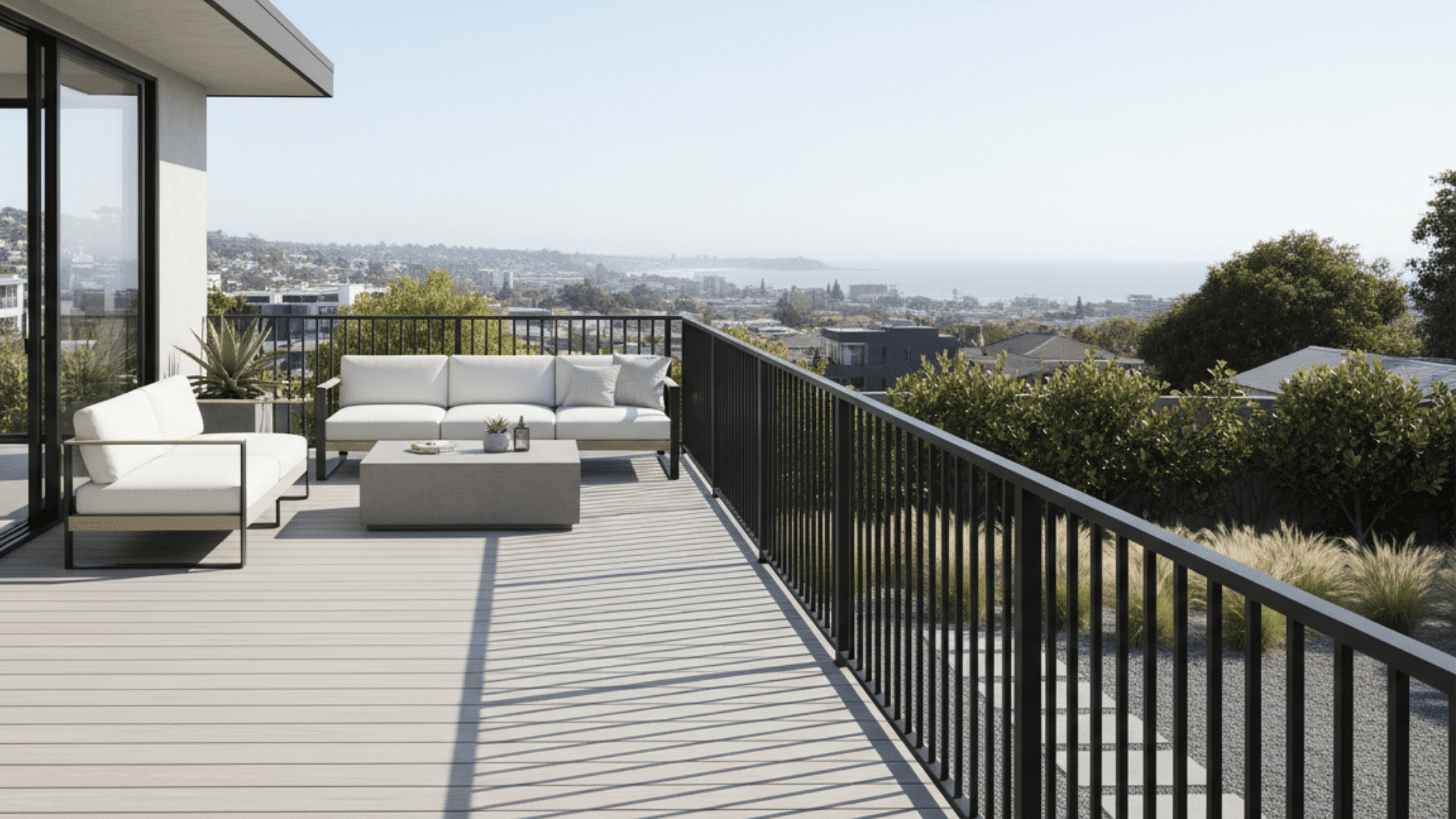 Deck with matte black powder-coated aluminum railings.