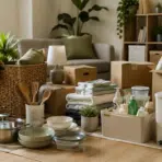 gathering apartment essentials including cookware towels storage boxes and everyday home items
