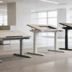 wide shot of three different styles of desk converters lined up in a bright and modern open plan office environment