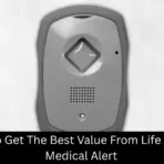 Gray medical alert device with speaker and button on plain white background
