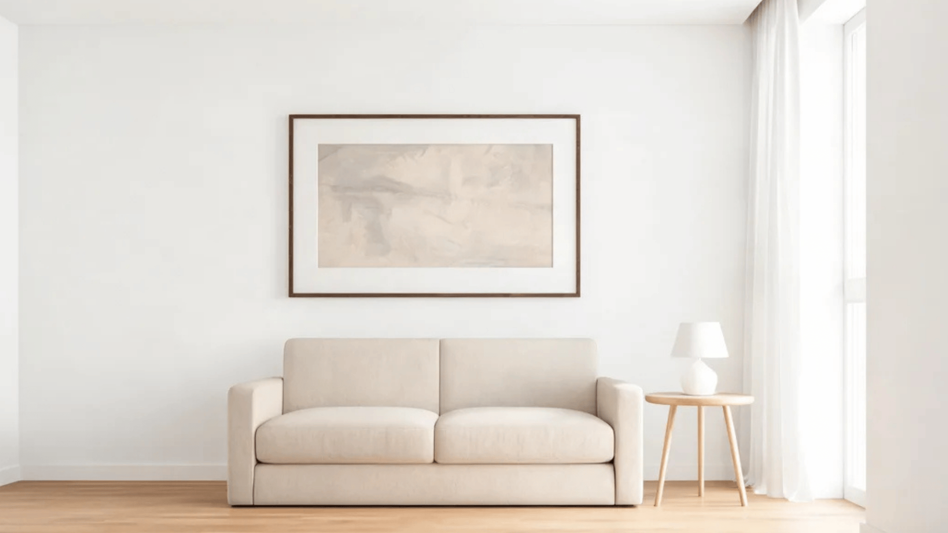 light beige sofa with wooden floor and abstract painting on white wall