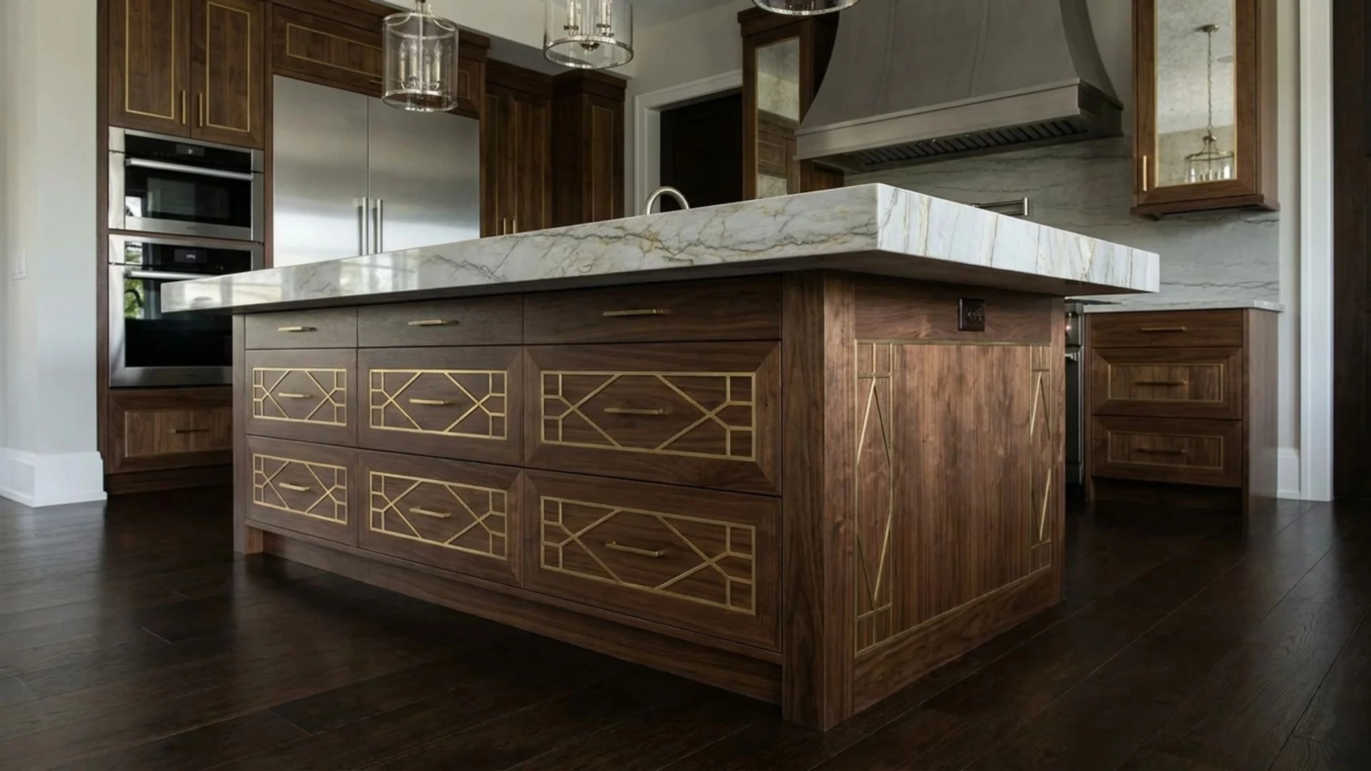 Claude responded: dark walnut kitchen island with brass geometric inlay drawer fronts and thick marble countertopdark walnut kitchen island with brass geometric inlay drawer fronts and thick marble countertop