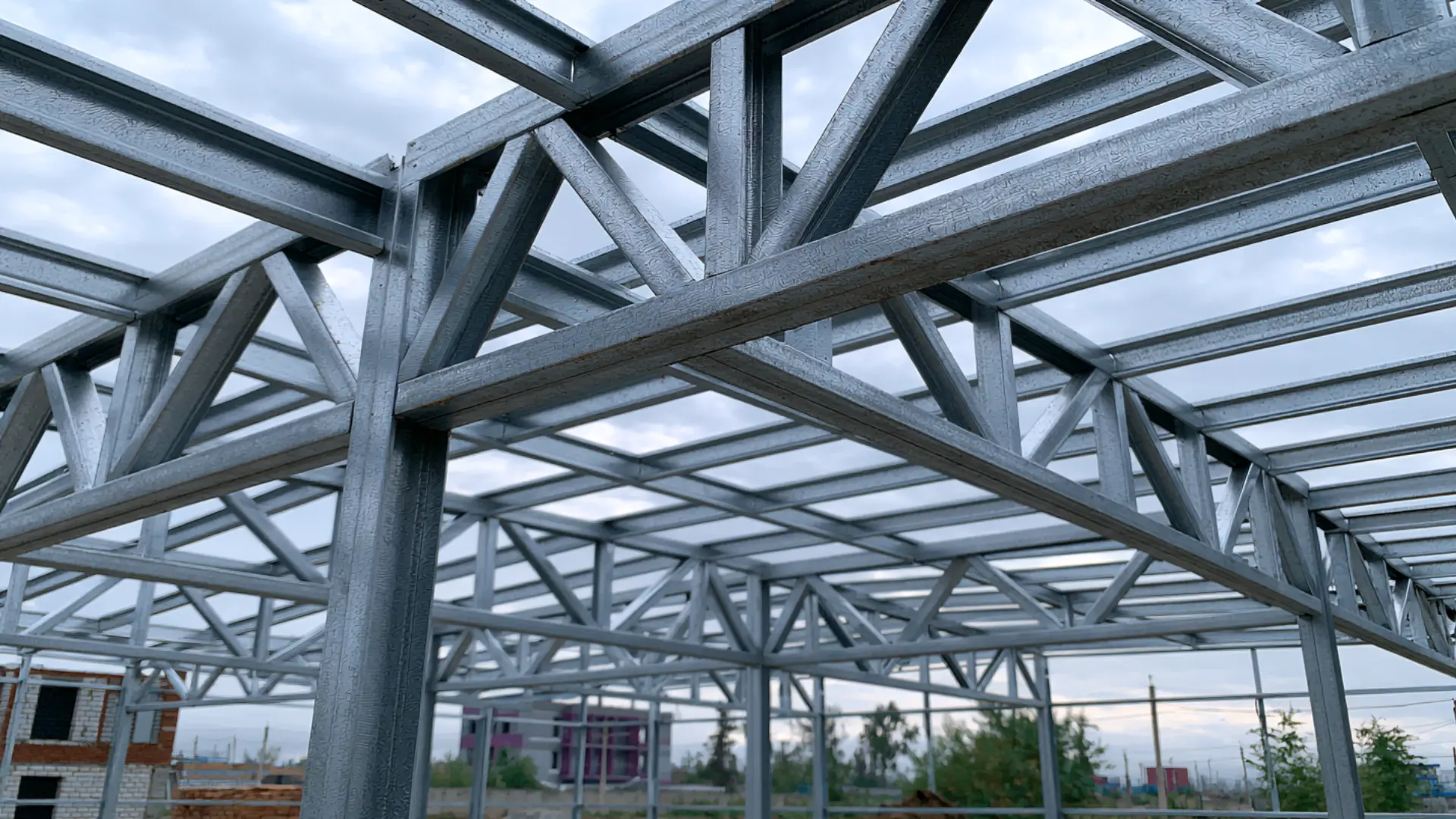 Galvanized steel purlins installed horizontally across a metal roof framework
