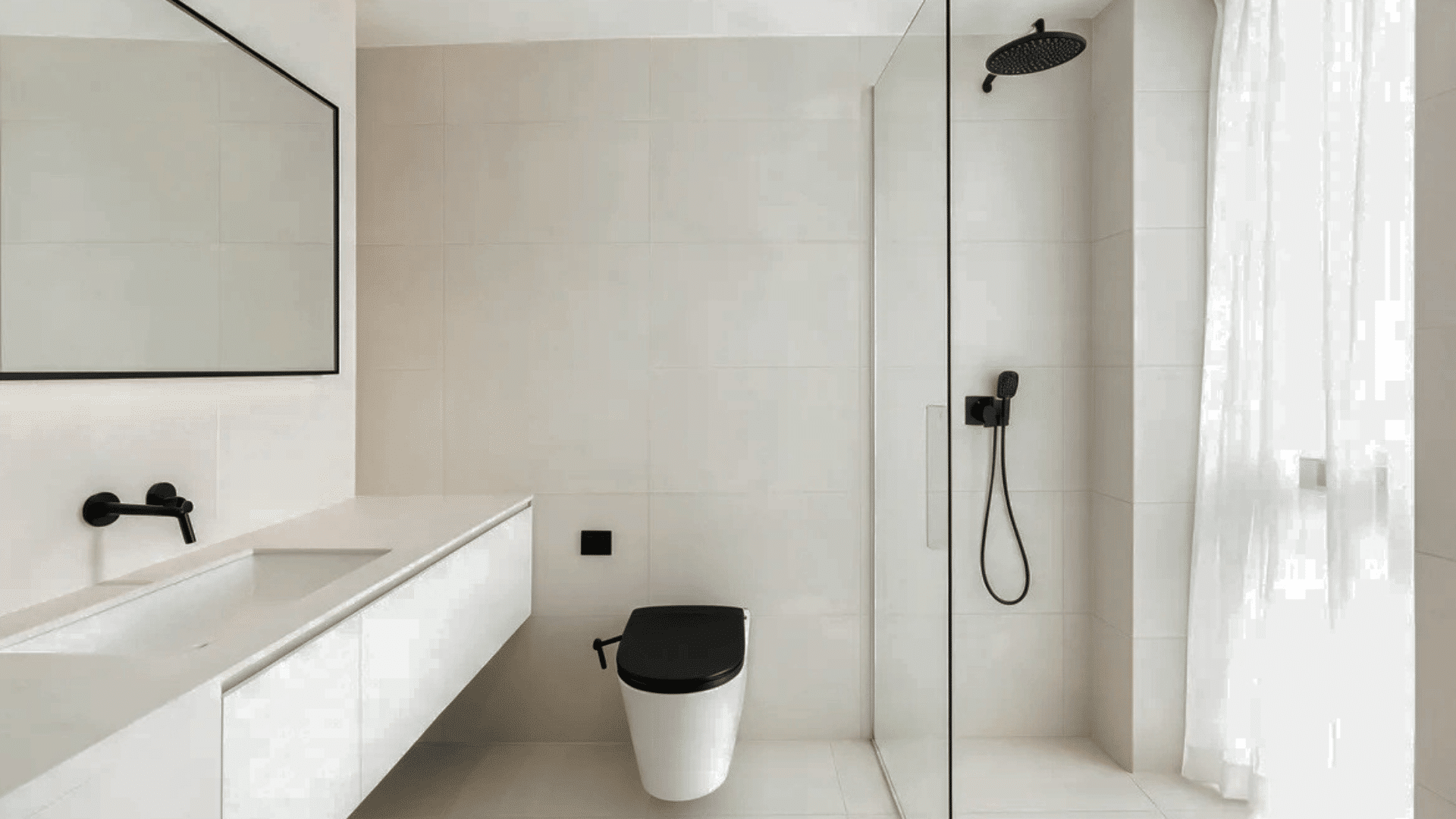 modern bathroom with black and white fixtures glass shower and large mirror