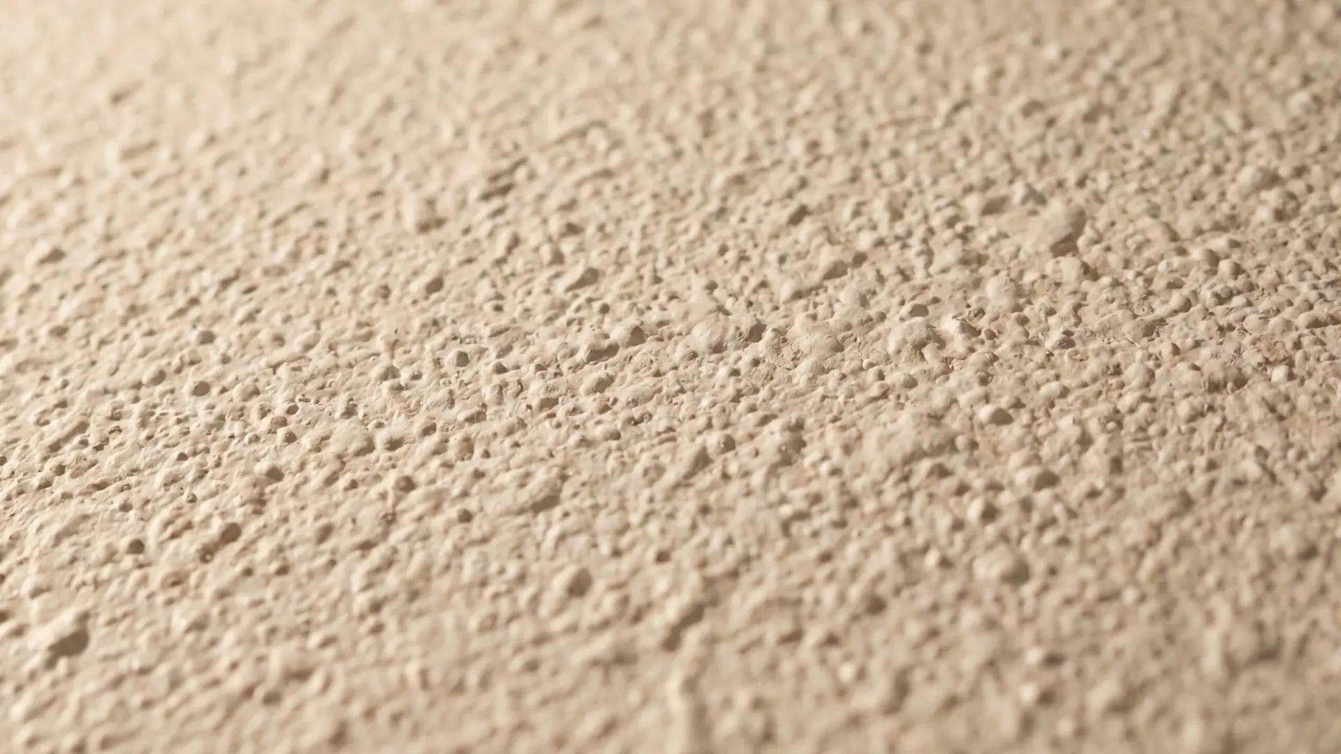 orange peel ceiling texture with tiny uniform bumps and soft natural light revealing surface depth