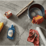 overhead flat lay of oil stain cleaning supplies