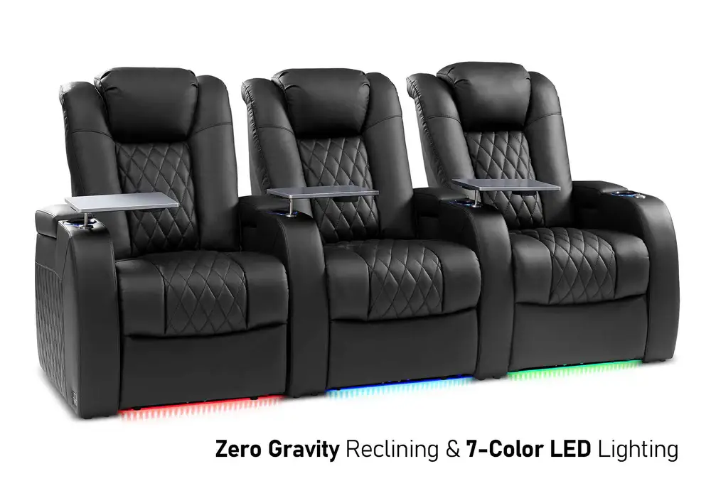 Black leather theater seats with cup holders and trays, illuminated with multicolor LED lights