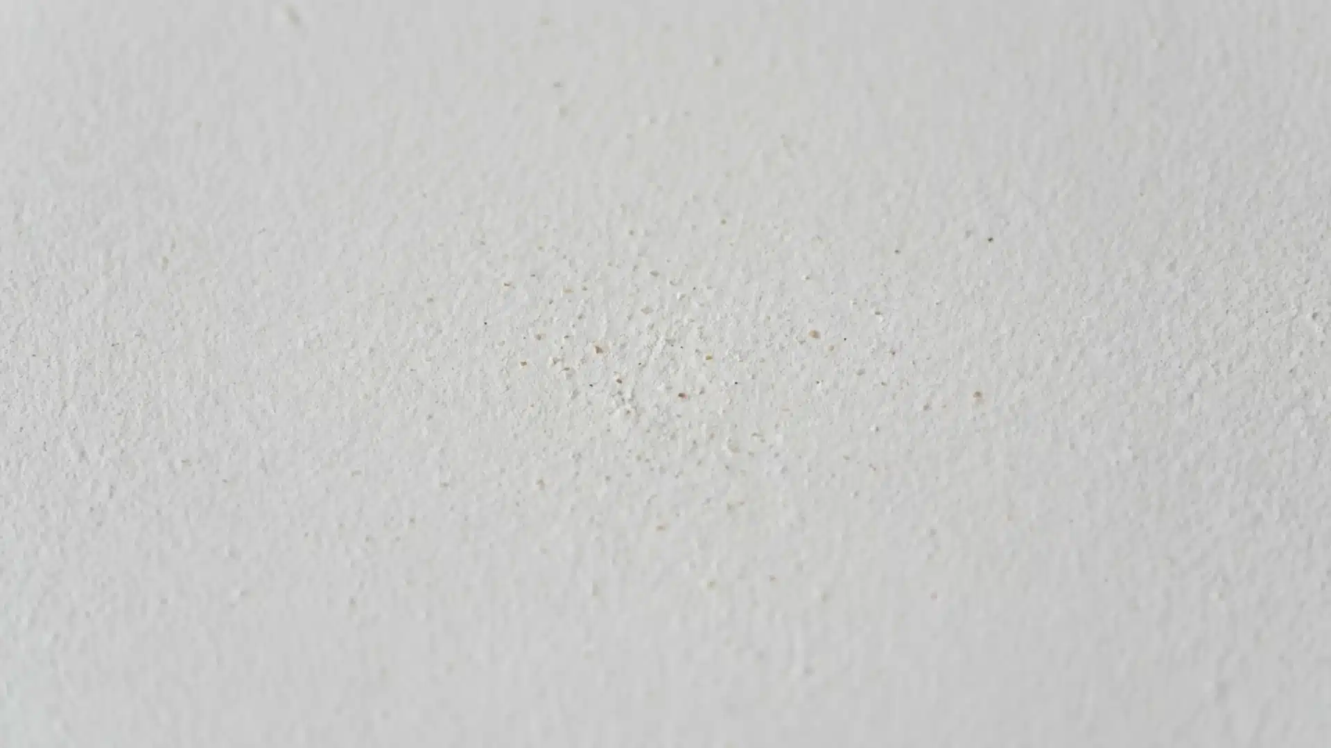 sand ceiling texture with subtle grainy surface finish and fine sand particles embedded in paint