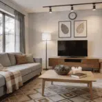 scandinavian living room with light wood furniture gray sofa open shelving and soft natural daylight