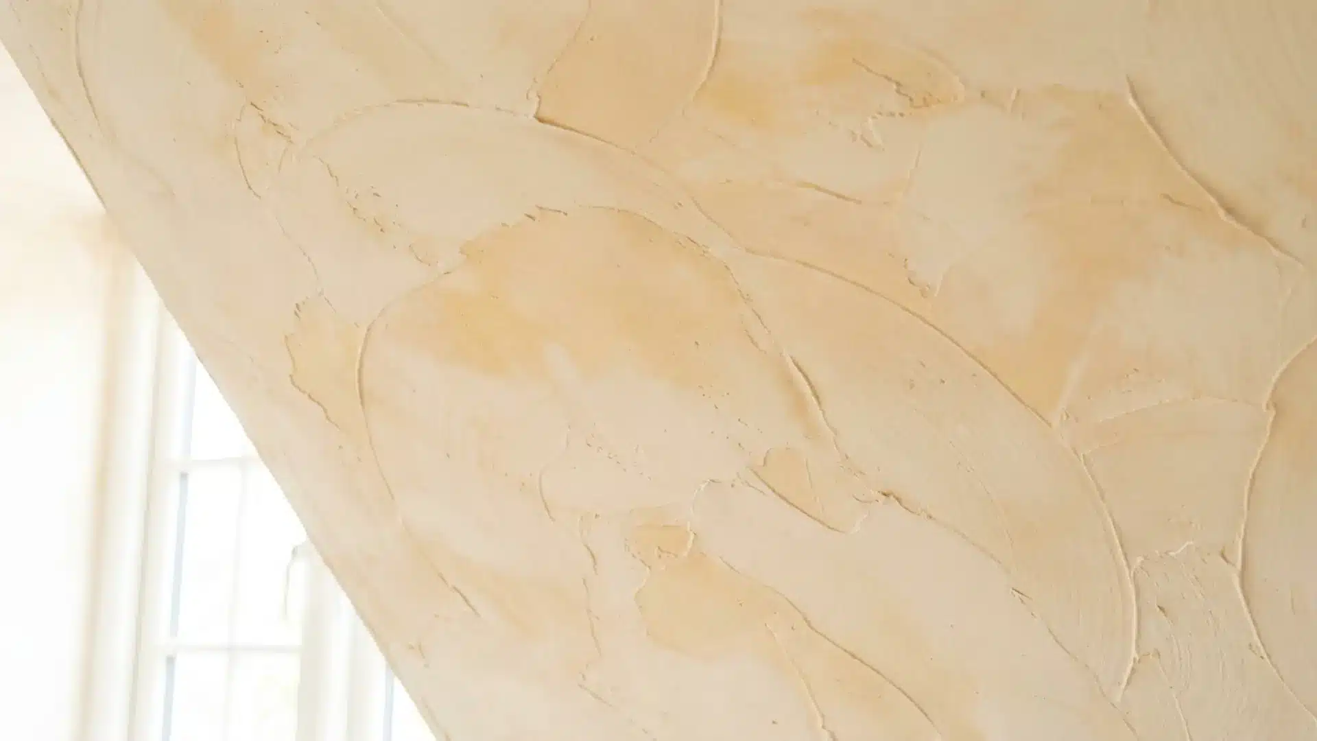 skip trowel ceiling texture with irregular flat plaster patches and visible curved trowel marks