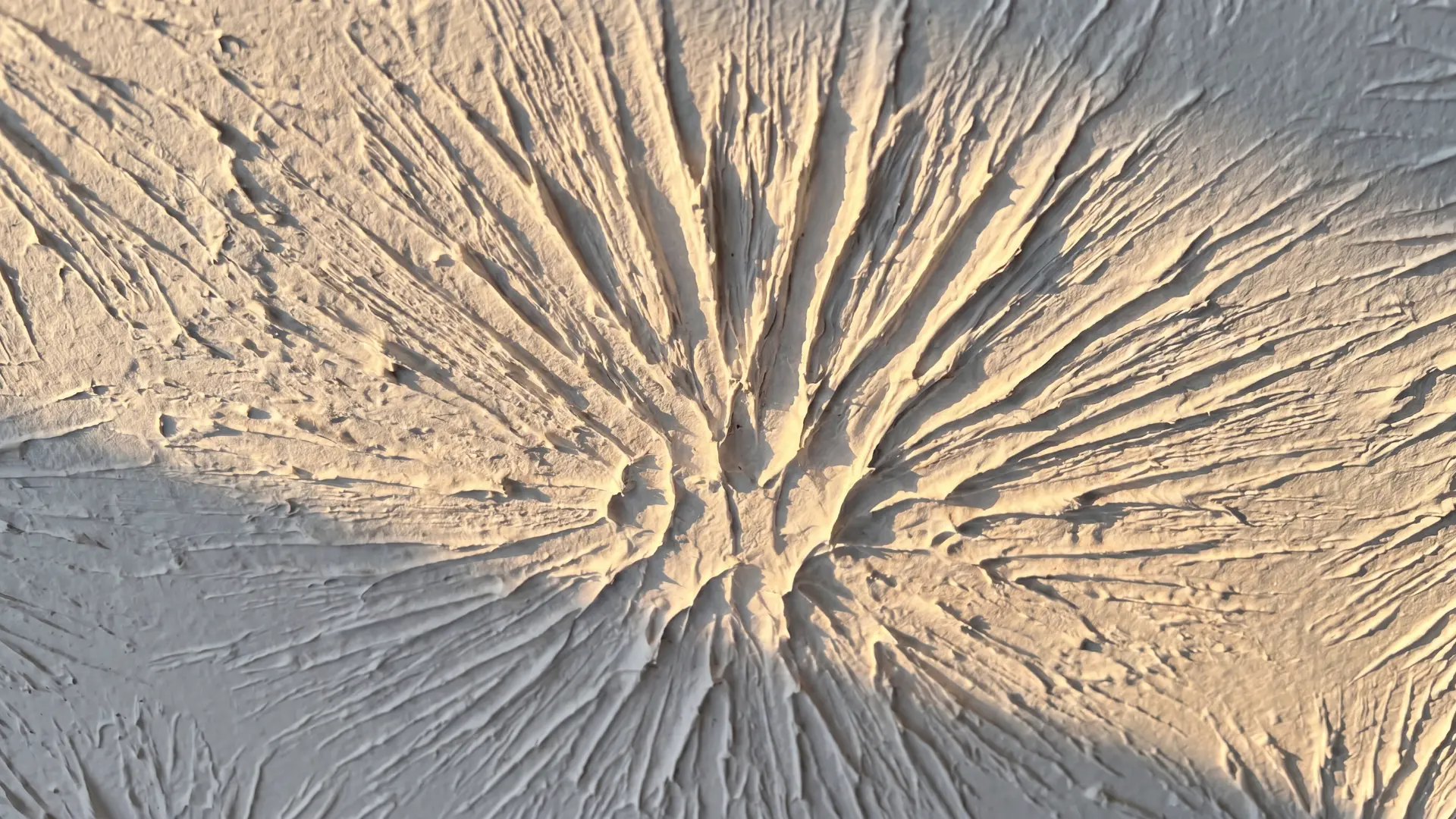 slap brush ceiling texture with bold random overlapping brush marks in white joint compound