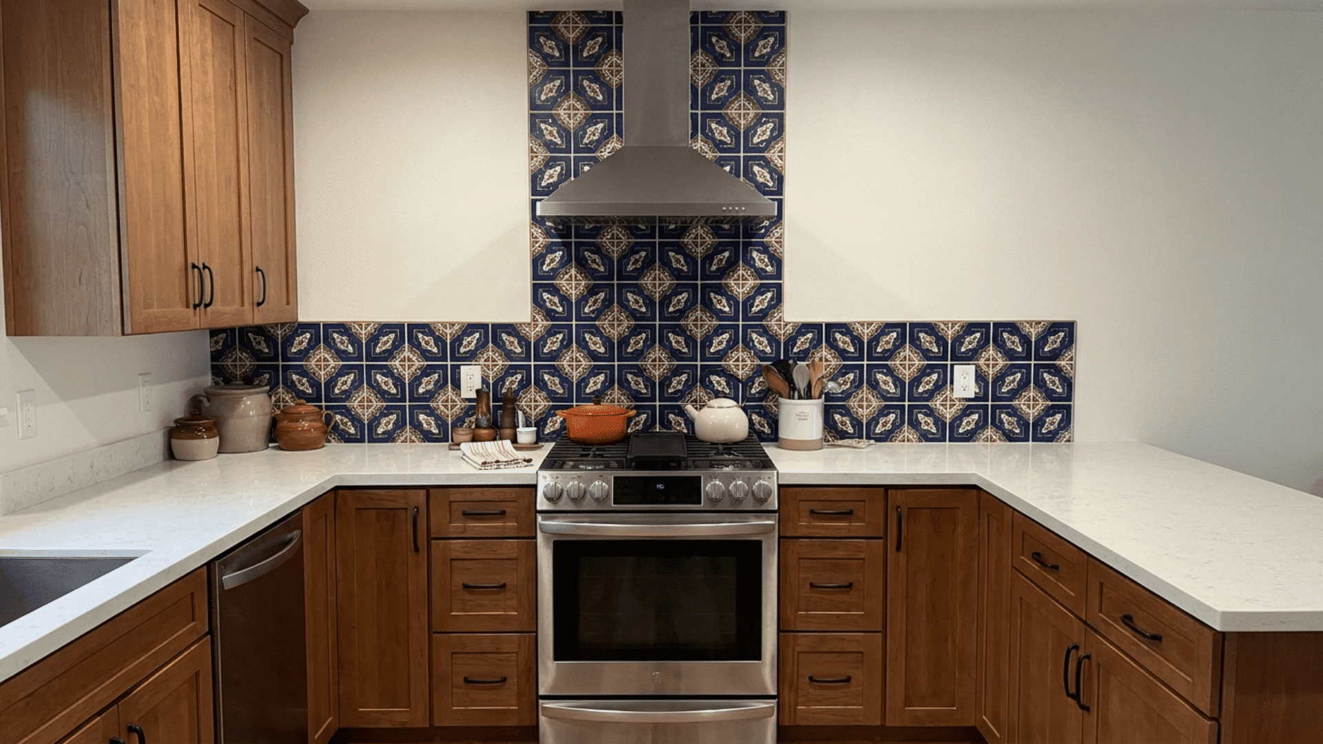 U-shaped kitchen featuring bold backsplash as a visual focal point for style.
