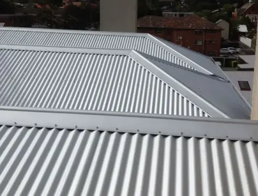 Corrugated metal roofing on residential building under overcast sky