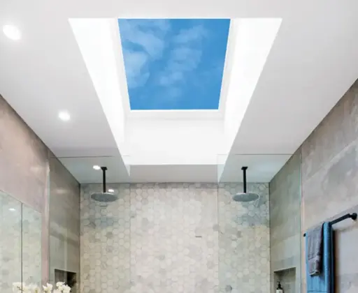 Modern bathroom with skylight, hexagonal tiles, dual rain showerheads, and gray walls