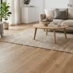 a minimalist living room with beige sofa wooden coffee table armchair indoor plant large window natural light rug artwork