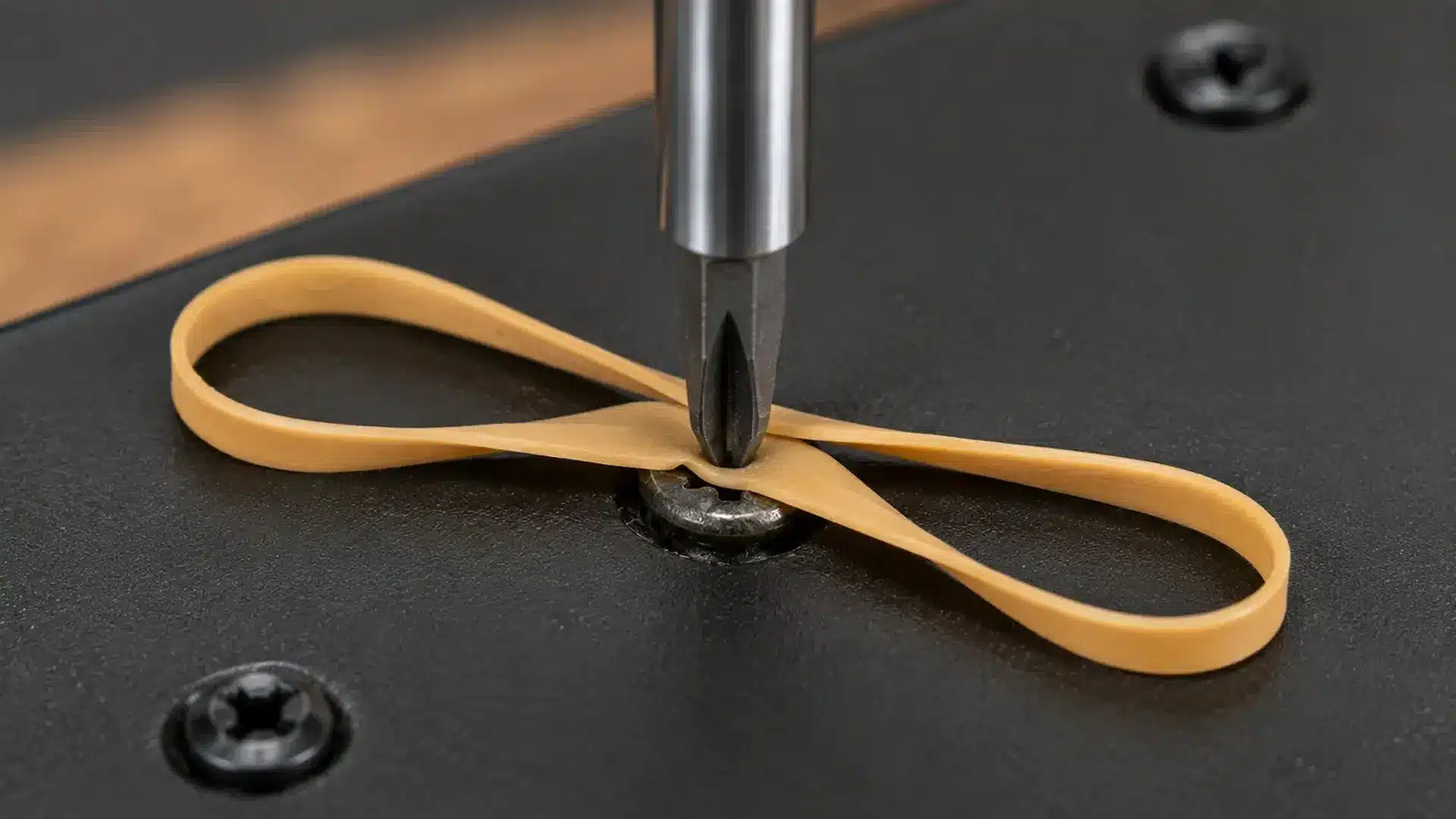 a rubber band trick can add extra grip when removing a lightly stripped screw