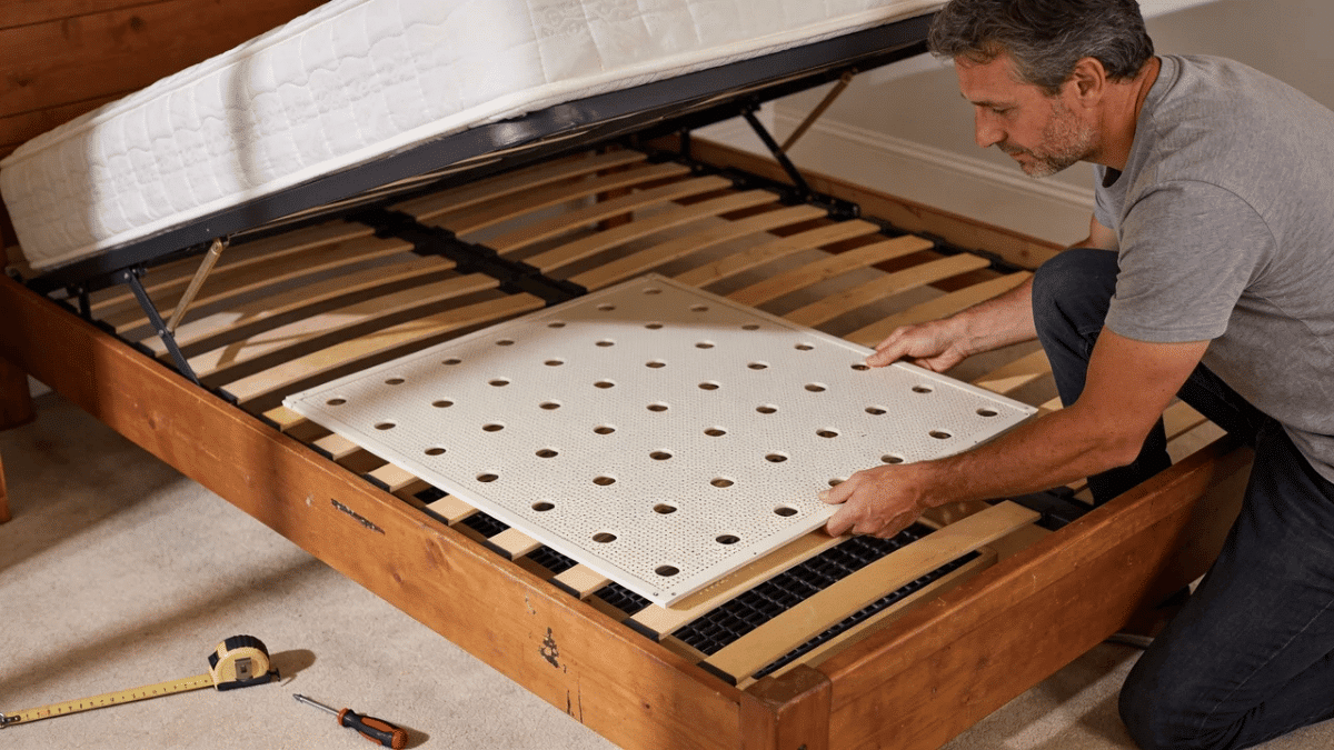 ventilated support panel being fitted over bed slats to reduce flex while maintaining mattress airflow