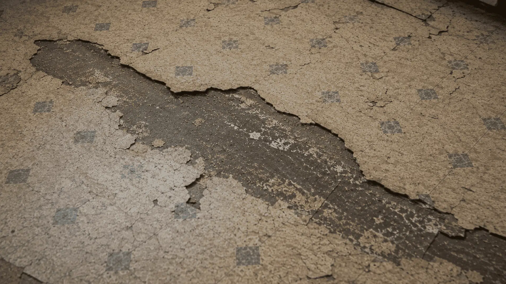 aged asbestos flooring showing peeling surface wear and visible deterioration in older flooring materials 