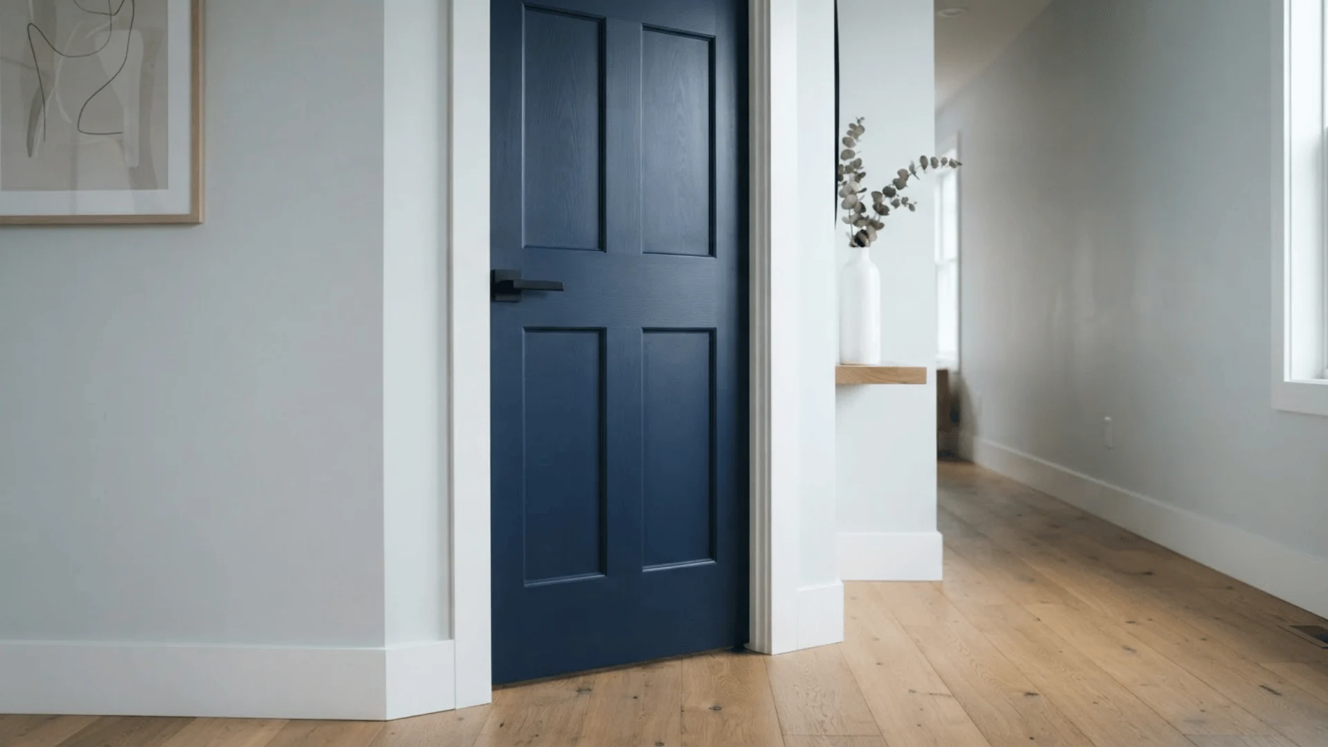 navy blue door against pale gray wall in modern bedroom