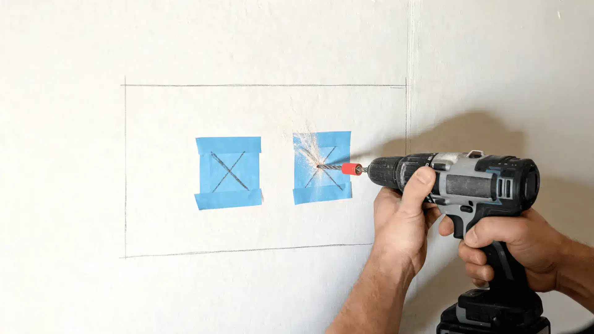 drill making pilot holes through marked points on a wall