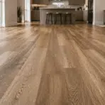 wide angle view of luxury vinyl plank flooring in modern living space showing realistic wood grain texture and bright natural interior lighting (1)