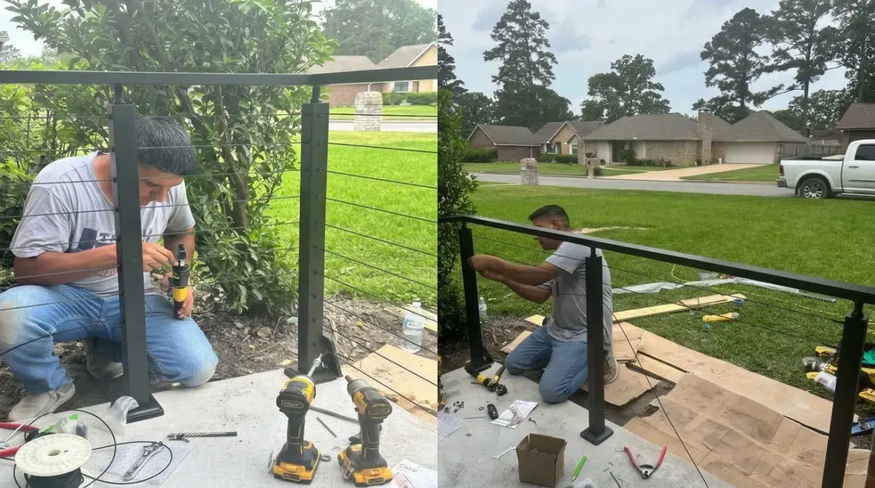 Man installing black metal railing on outdoor patio with tools and greenery nearby