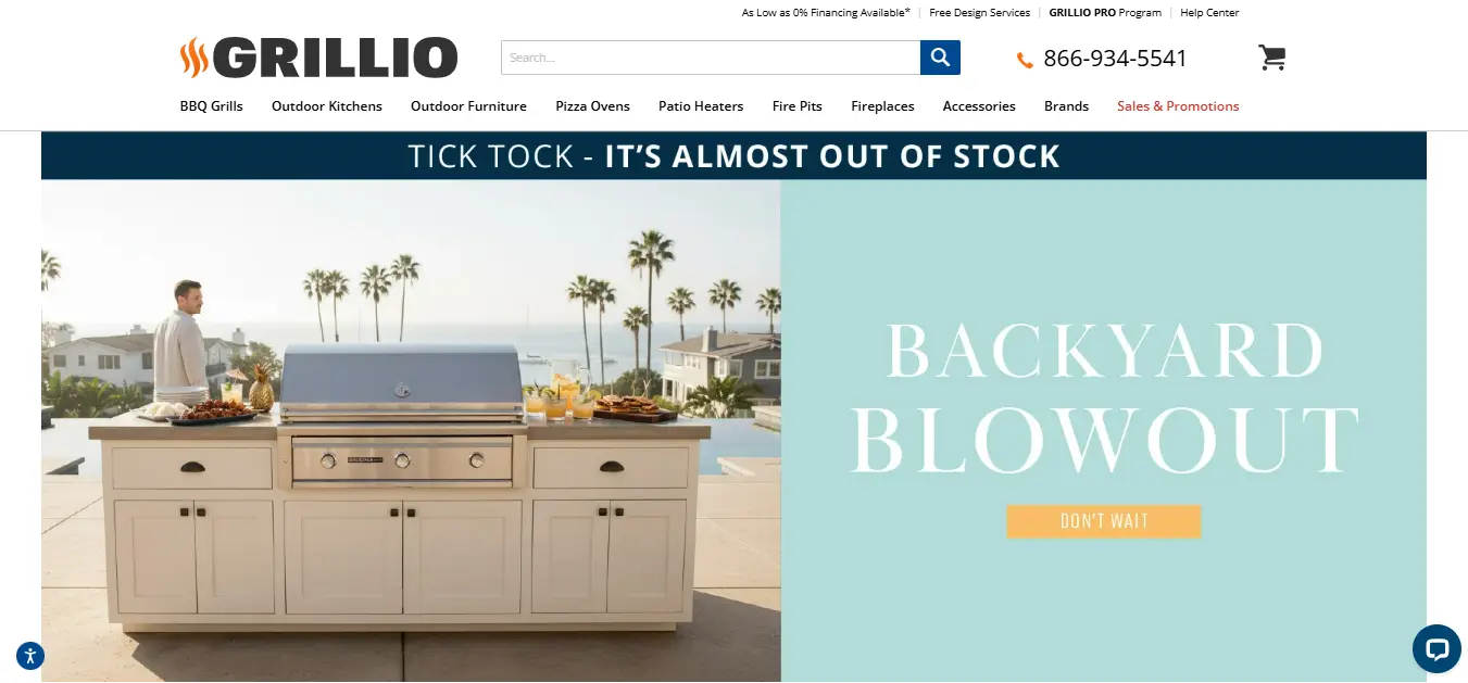 Outdoor kitchen setup with stainless steel grill and man standing beside, ocean view background