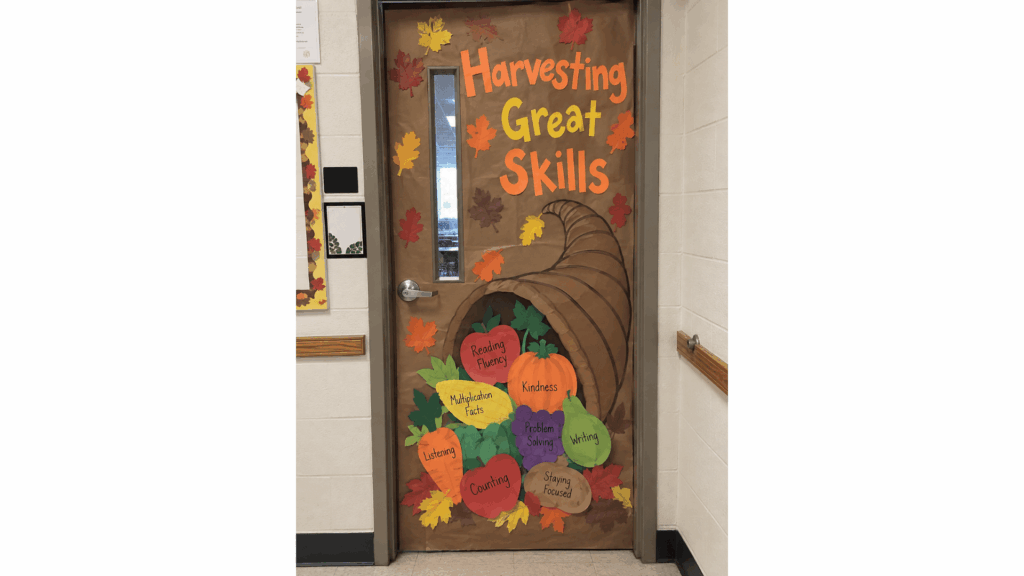 classroom door cornucopia with paper fruit labeled with student learning skills
