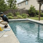 pool technician checking equipment beside a residential pool while a homeowner reviews a maintenance estimate