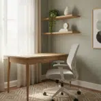 Modern home office with wooden desk, gray office chair, abstract art, and natural light from window
