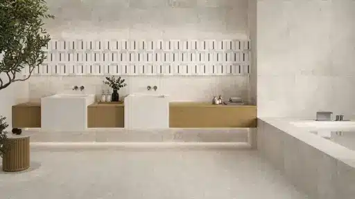 Modern bathroom with twin sinks on wooden vanity and geometric wall tiles in neutral tones