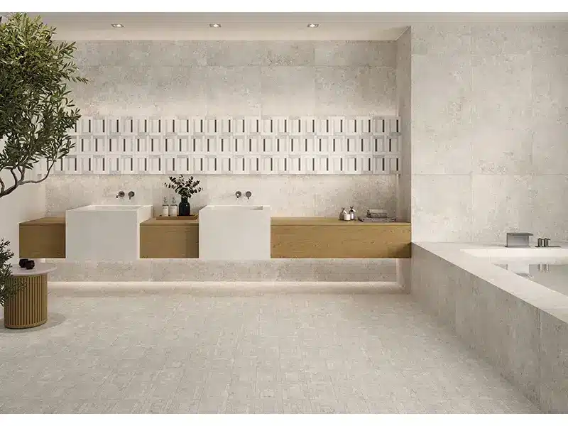 Modern bathroom with twin sinks on wooden vanity and geometric wall tiles in neutral tones