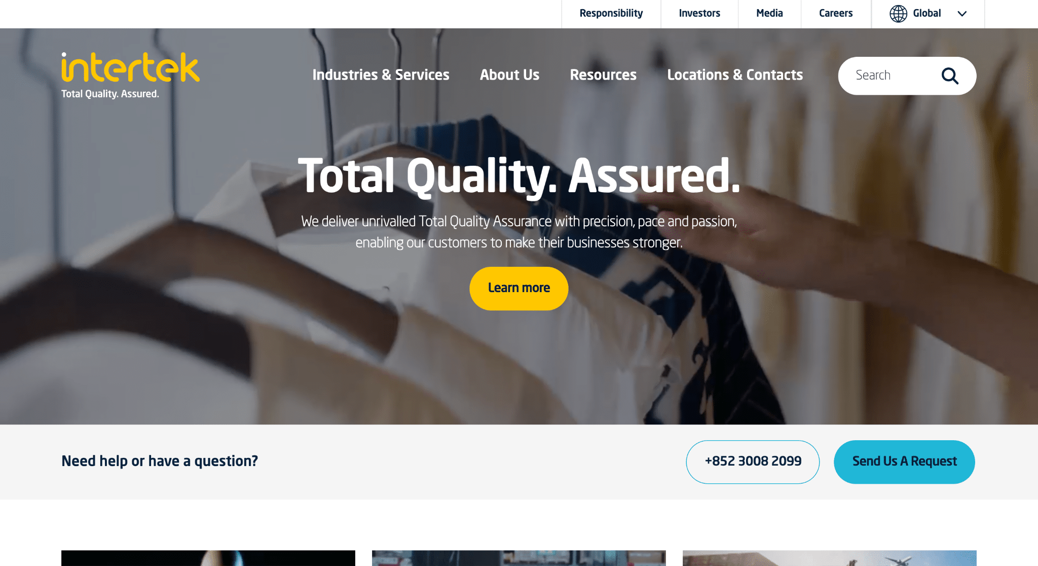 Hand selecting a shirt from a rack with blurred background