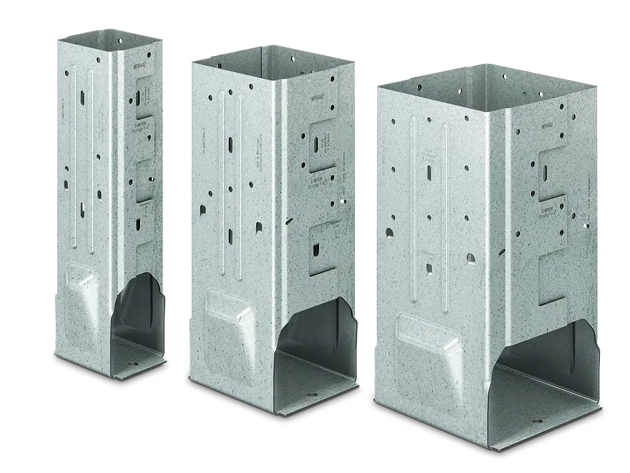 Three galvanized steel post bases of varying sizes on white background